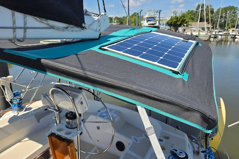 Slide: The Image of Sailboat Tartan 3700 (2005) with solar panel on deck, docked at marina. - 50