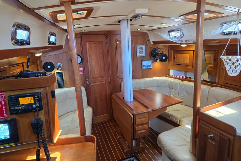 Slide: The Image of Luxurious 2005 Tartan 3700 yacht interior with wood finish and plush seating. - 29
