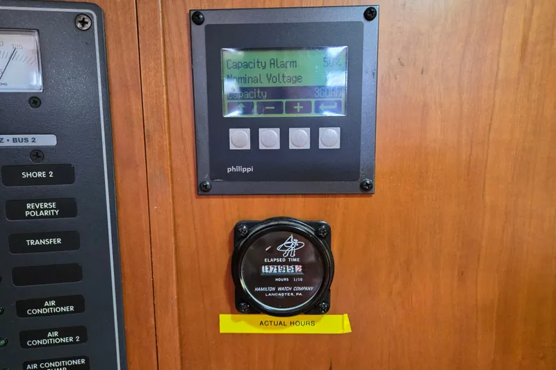 Slide: The Image of Control panel on a 2005 Tartan 3700 yacht, displaying capacity alarm and elapsed time. - 24