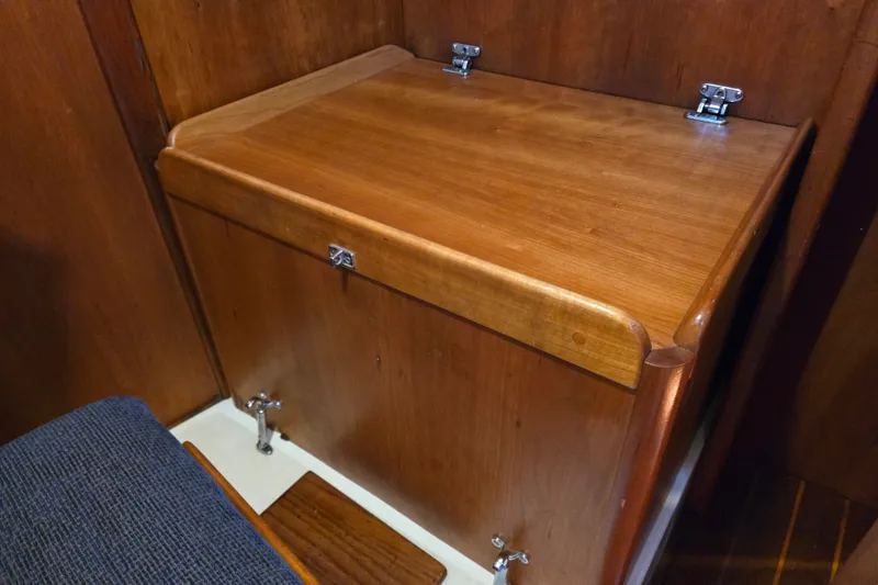 Slide: The Image of Wooden interior detail of a 2005 Tartan 3700 yacht, featuring polished cabinetry and metal fixtures. - 45