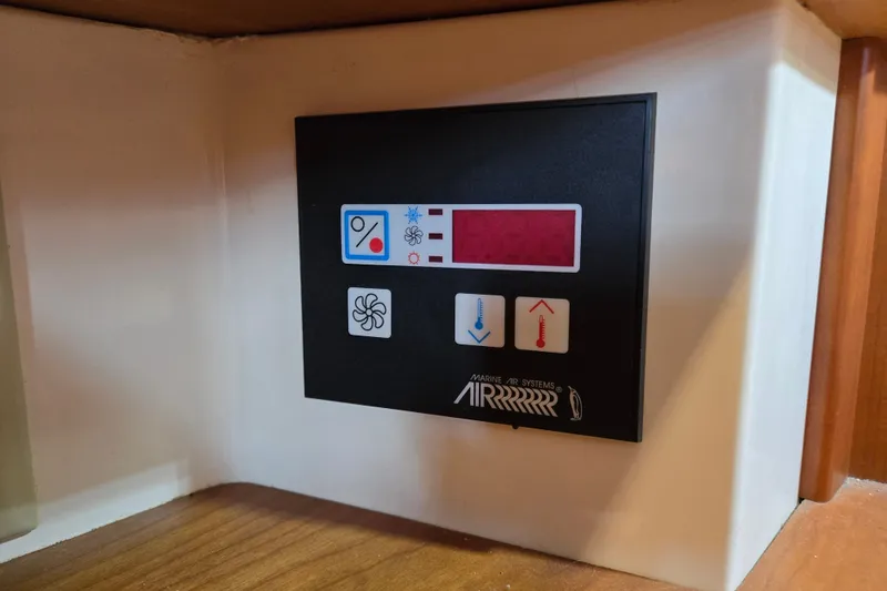Slide: The Image of Control panel of a 2005 Tartan 3700 Marine Air Systems, featuring temperature and fan controls. - 31