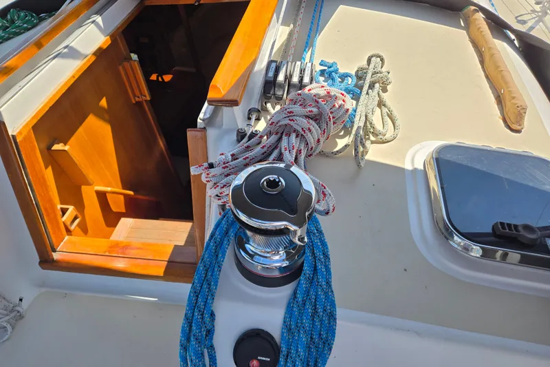 Slide: The Image of Deck of 2005 Tartan 3700 sailboat with ropes and winch. - 14