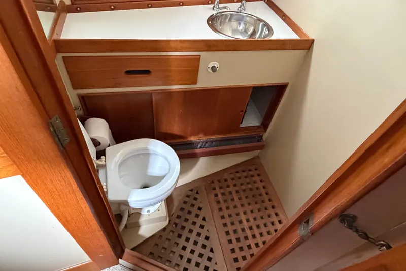 Slide: The Image of Bathroom interior of 1969 Grand Banks 42 Classic yacht with wooden cabinetry and fixtures. - 37