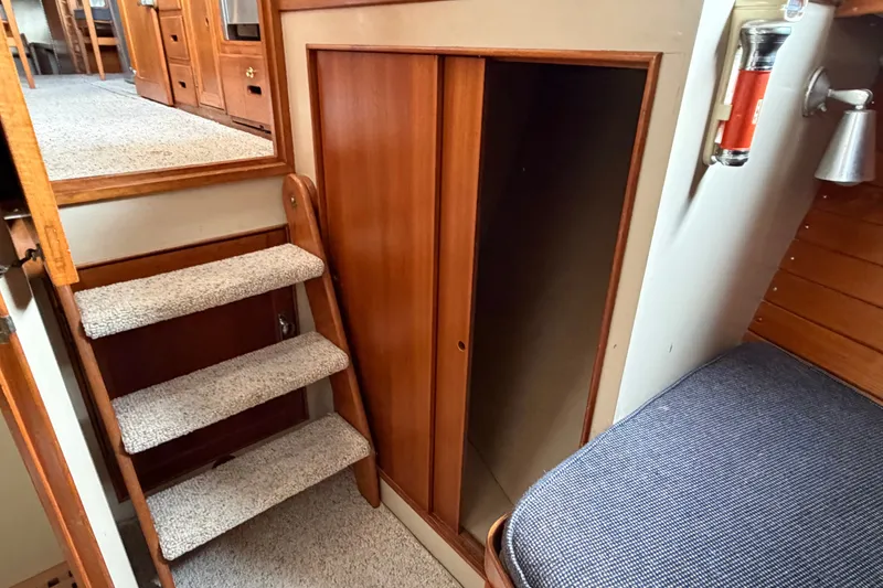 Slide: The Image of Interior of 1969 Grand Banks 42 Classic with wooden stairs and storage. - 36