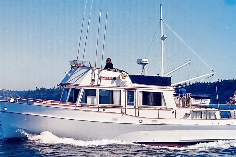 The Image of 1969 Grand Banks 42 Classic yacht cruising on open water. - 1