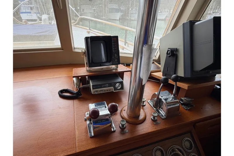 Slide: The Image of Helm of 1969 Grand Banks 42 Classic with navigation equipment and controls. - 23