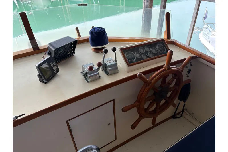Slide: The Image of Helm of 1969 Grand Banks 42 Classic with wooden wheel and navigation instruments. - 15