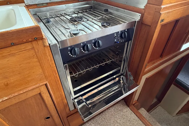 Slide: The Image of Stainless steel stove and oven in 1969 Grand Banks 42 Classic yacht kitchen. - 30