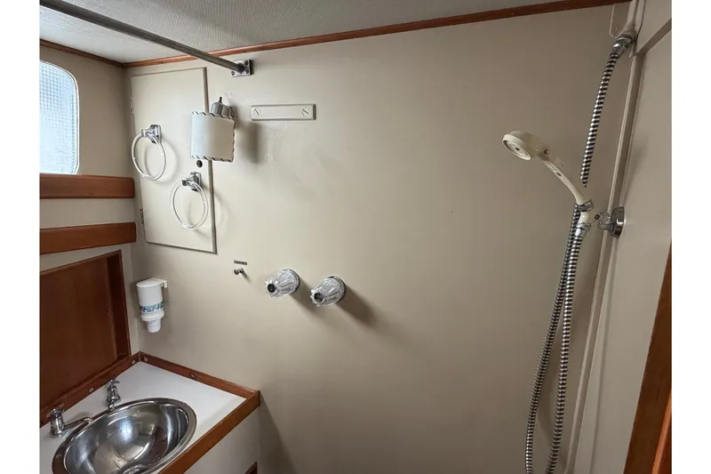 Slide: The Image of Bathroom interior of 1969 Grand Banks 42 Classic yacht with shower and sink. - 39