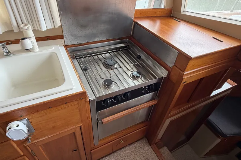Slide: The Image of Galley kitchen in 1969 Grand Banks 42 Classic yacht with stove and sink. - 29