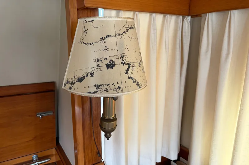 Slide: The Image of Vintage lamp with nautical map shade on 1969 Grand Banks 42 Classic yacht. - 31