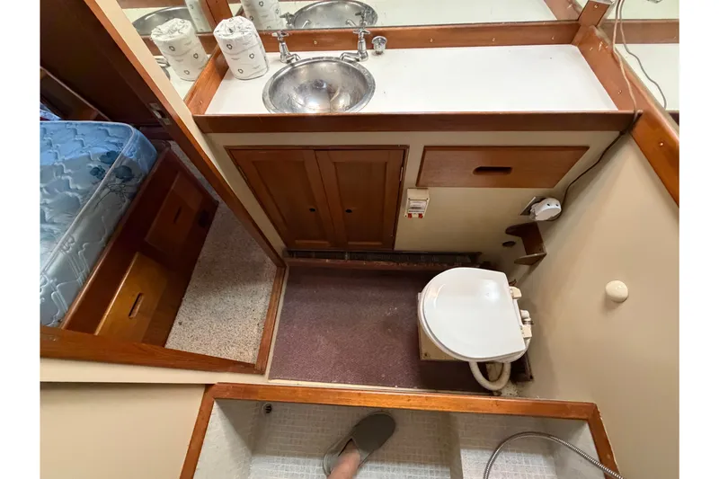 Slide: The Image of Bathroom interior of a 1969 Grand Banks 42 Classic yacht, featuring sink and toilet. - 47