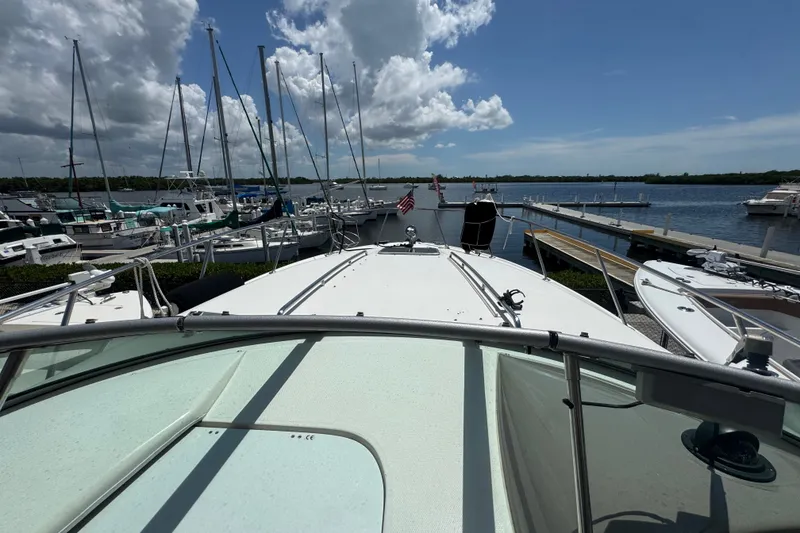 Slide: The Image of 2008 Chaparral Signature 290 docked at marina with sailboats and clear sky. - 36