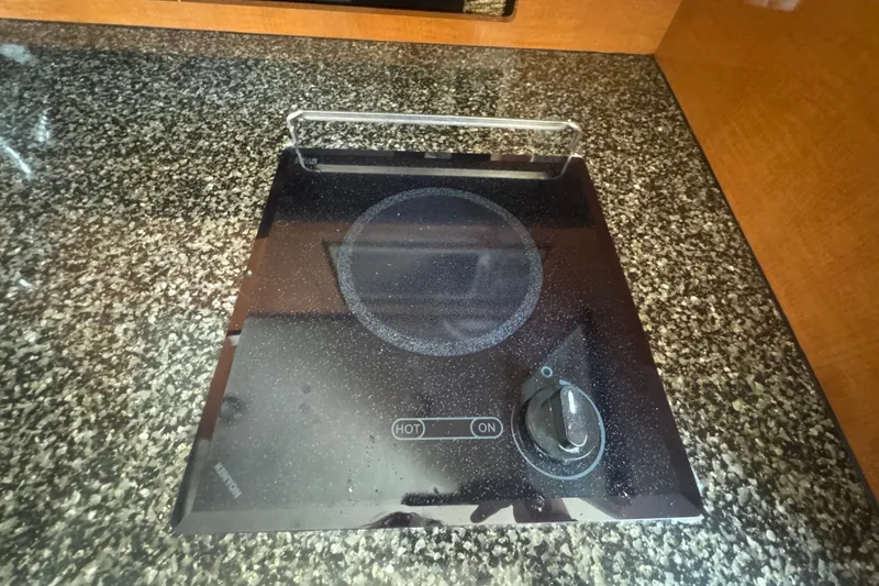 Slide: The Image of Electric stove on granite countertop in 2008 Chaparral Signature 290 boat kitchen. - 31