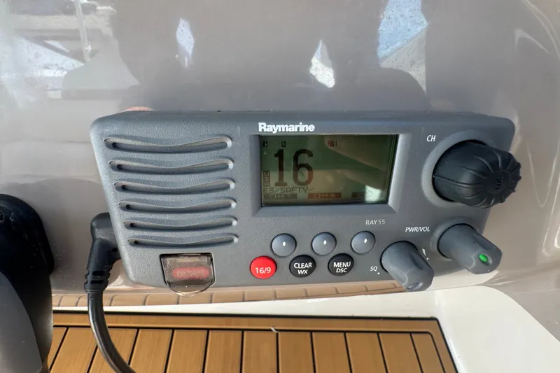 Slide: The Image of Raymarine radio on 2008 Chaparral Signature 290 boat dashboard. - 62