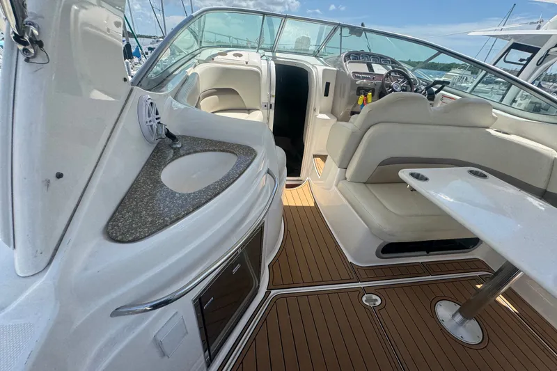 Slide: The Image of 2008 Chaparral Signature 290 boat interior with seating, table, and sink. - 14