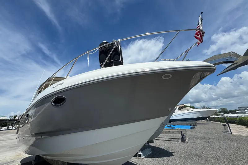 The Image of 2008 Chaparral Signature 290 boat on display under a clear blue sky. - 0