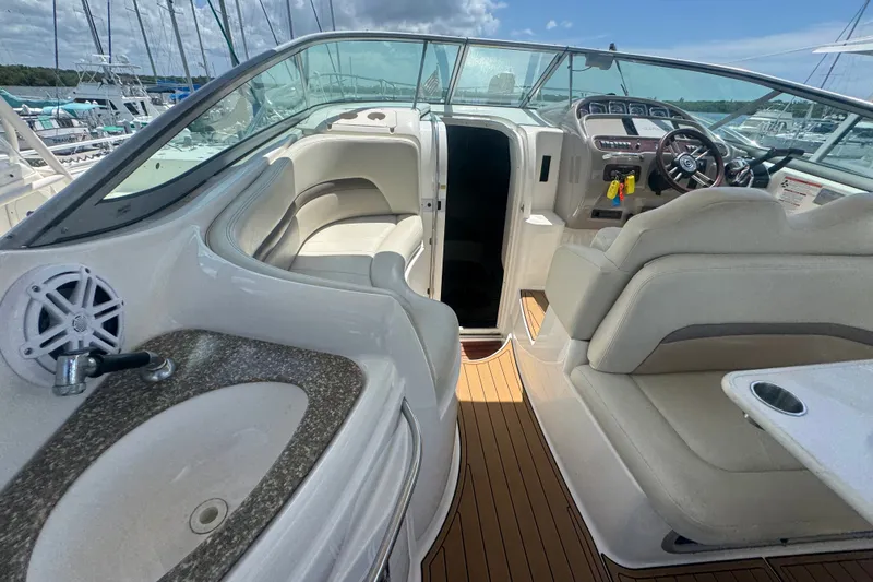 Slide: The Image of 2008 Chaparral Signature 290 boat interior with seating, steering wheel, and sink. - 15