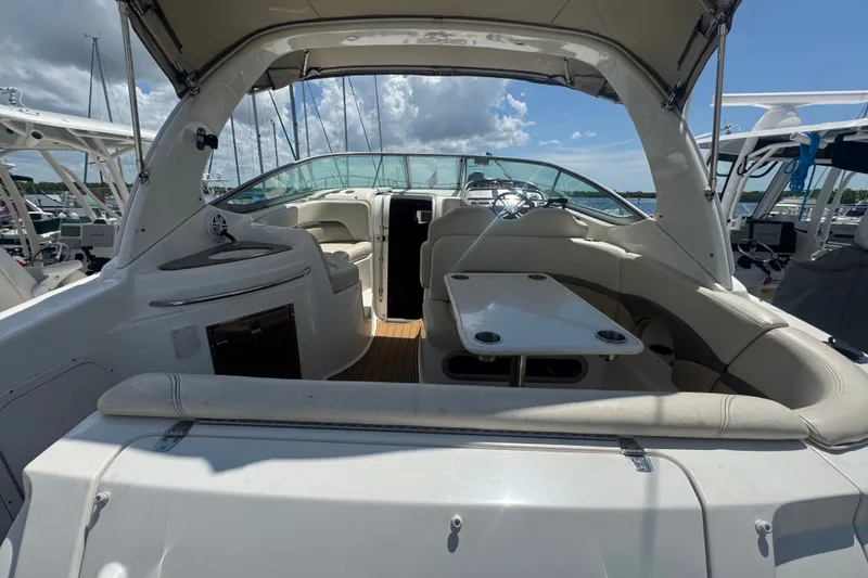 Slide: The Image of 2008 Chaparral Signature 290 boat interior with seating and table under canopy. - 12