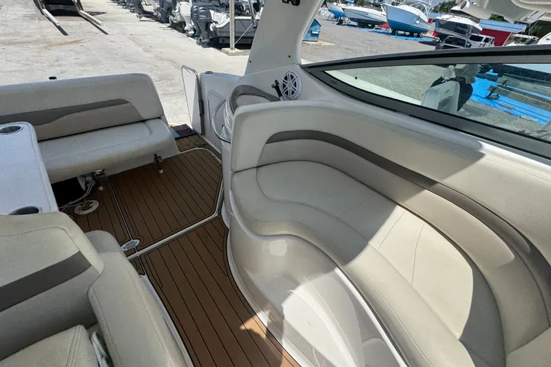 Slide: The Image of Interior view of 2008 Chaparral Signature 290 boat with beige seating and wood flooring. - 49