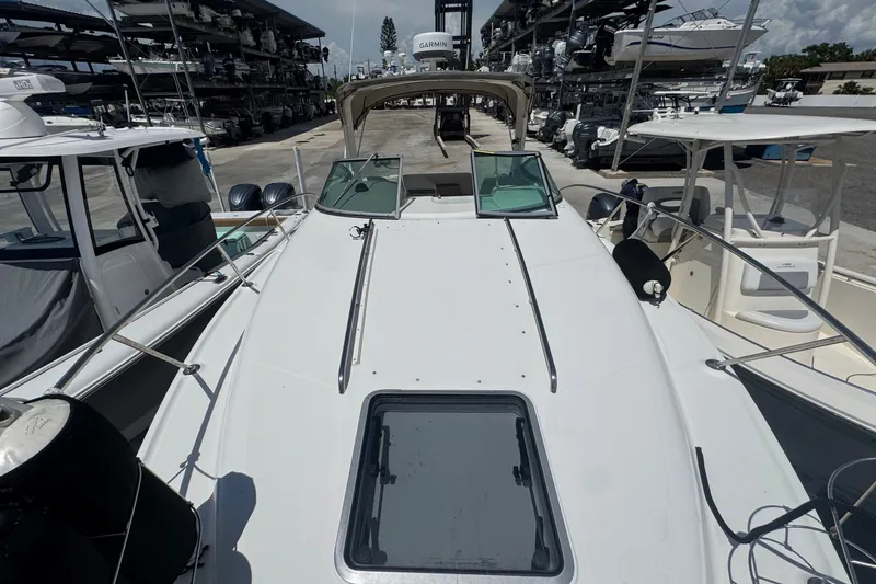 Slide: The Image of 2008 Chaparral Signature 290 boat docked, surrounded by other vessels in a marina. - 41