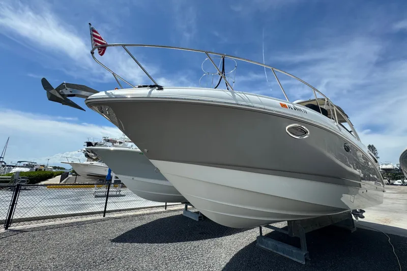 Slide: The Image of 2008 Chaparral Signature 290 boat on display under a clear blue sky. - 7
