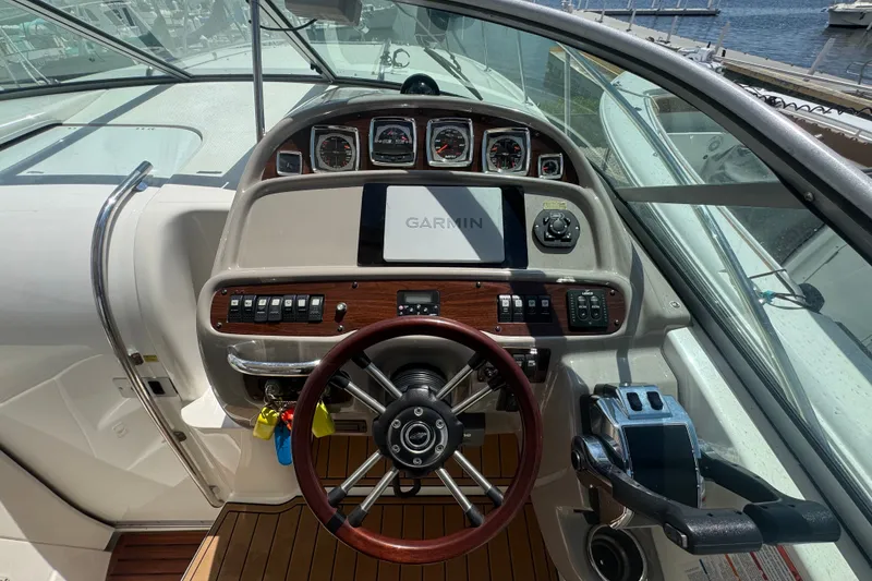Slide: The Image of Cockpit of 2008 Chaparral Signature 290 with Garmin navigation system and wooden steering wheel. - 35