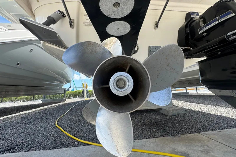 Slide: The Image of Close-up of a 2008 Chaparral Signature 290 boat propeller in a storage area. - 5