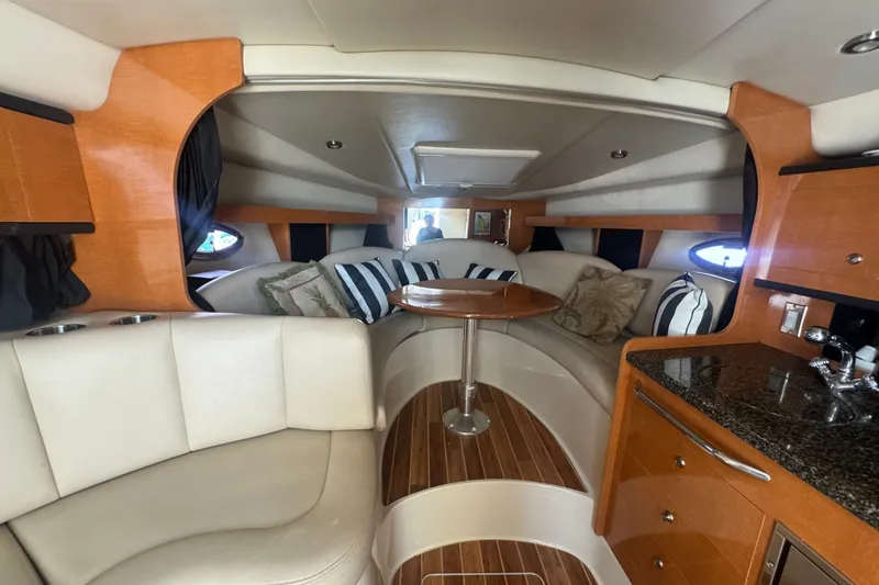 Slide: The Image of Interior of 2008 Chaparral Signature 290 yacht with cozy seating and modern amenities. - 25