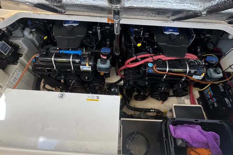 Slide: The Image of Engine compartment of a 2008 Chaparral Signature 290 boat, showcasing dual engines. - 70