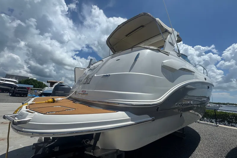 Slide: The Image of 2008 Chaparral Signature 290 boat docked under a cloudy sky. - 1