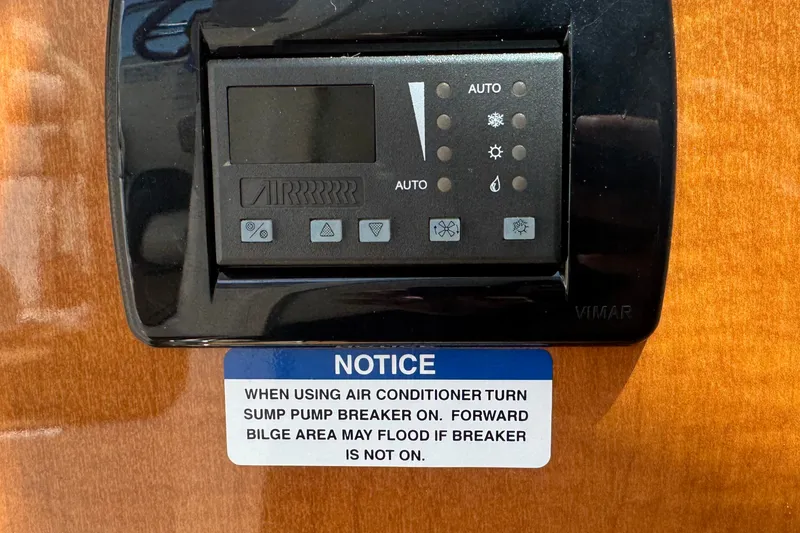 Slide: The Image of Control panel on 2008 Chaparral Signature 290 with air conditioner usage notice. - 75