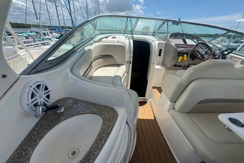 Slide: The Image of 2008 Chaparral Signature 290 boat interior with seating, steering wheel, and sink. - 16