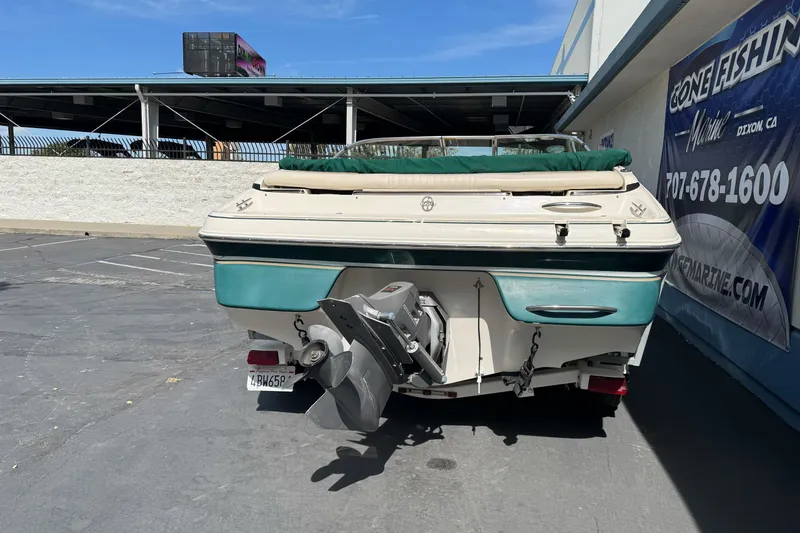 Slide: The Image of 2000 Monterey 190LS Montura boat parked outdoors, rear view. - 6