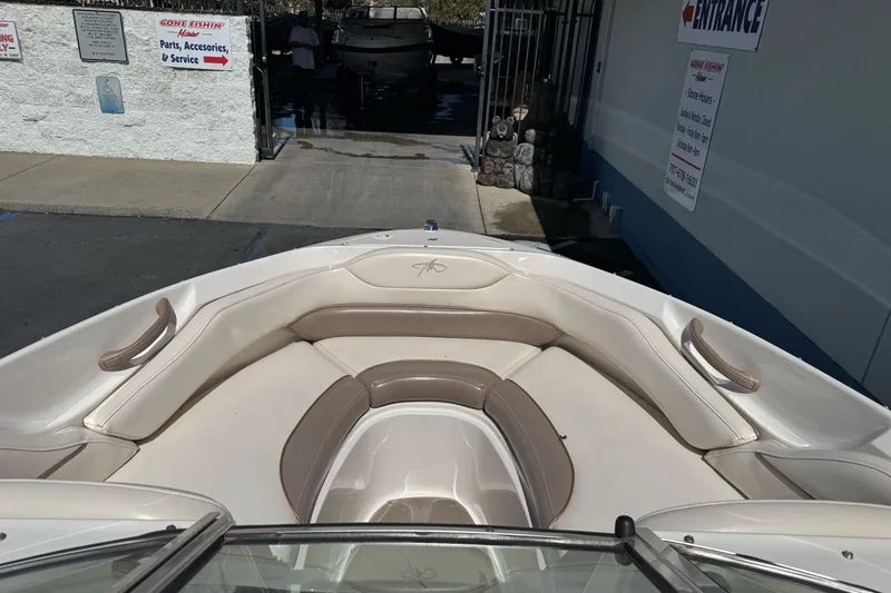 Slide: The Image of Bow seating area of a 2000 Monterey 190LS Montura boat at a service center. - 12