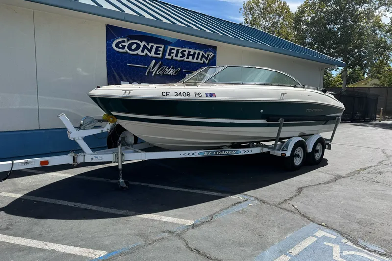 Slide: The Image of 2000 Monterey 190LS Montura boat on trailer at Gone Fishin' Marine dealership. - 2