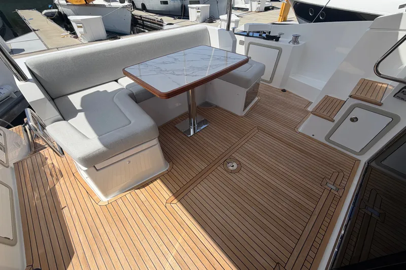 Slide: The Image of Luxurious Azimut Fly 50 yacht deck with seating and table, 2020 model. - 15