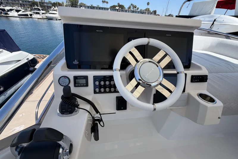 Slide: The Image of Cockpit of 2020 Azimut Fly 50 yacht with modern steering and navigation controls. - 10