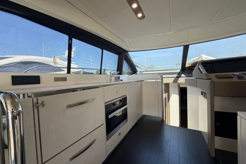 Slide: The Image of Luxurious interior of 2020 Azimut Fly 50 yacht with modern kitchen and panoramic windows. - 22