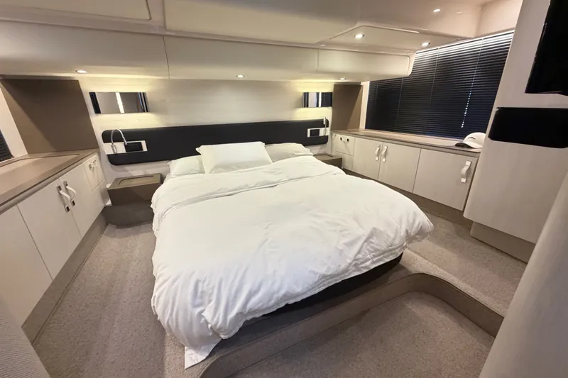 Slide: The Image of Luxurious bedroom interior of 2020 Azimut Fly 50 yacht, featuring modern design and cozy bedding. - 31