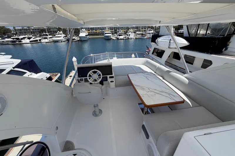 Slide: The Image of Luxurious 2020 Azimut Fly 50 yacht interior with helm and seating area in marina. - 9