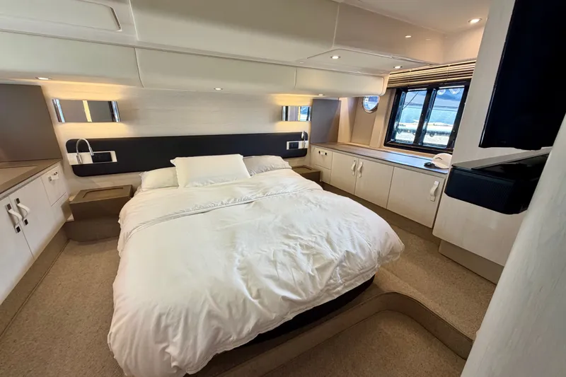 Slide: The Image of Luxurious bedroom interior of 2020 Azimut Fly 50 yacht with modern design and cozy ambiance. - 30