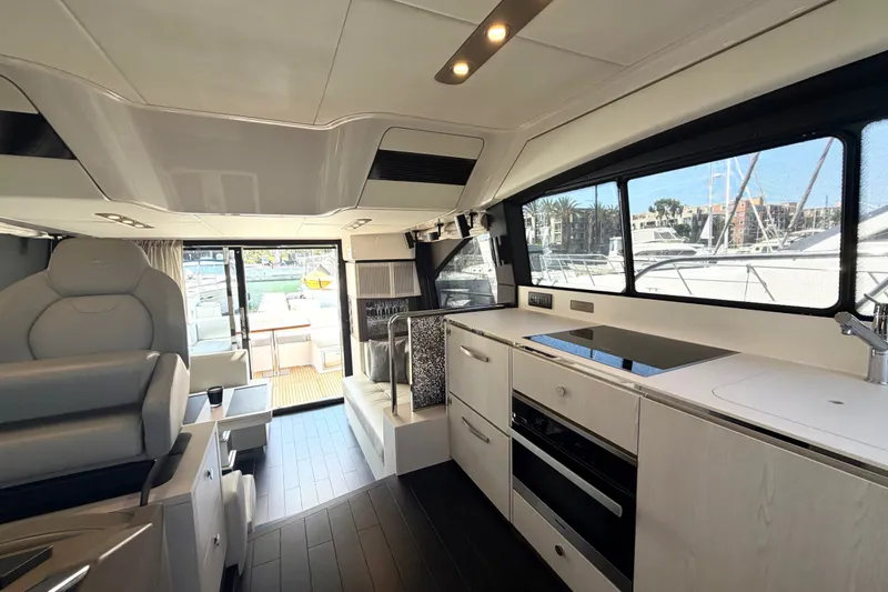 Slide: The Image of Luxurious interior of 2020 Azimut Fly 50 yacht with modern kitchen and seating area. - 23