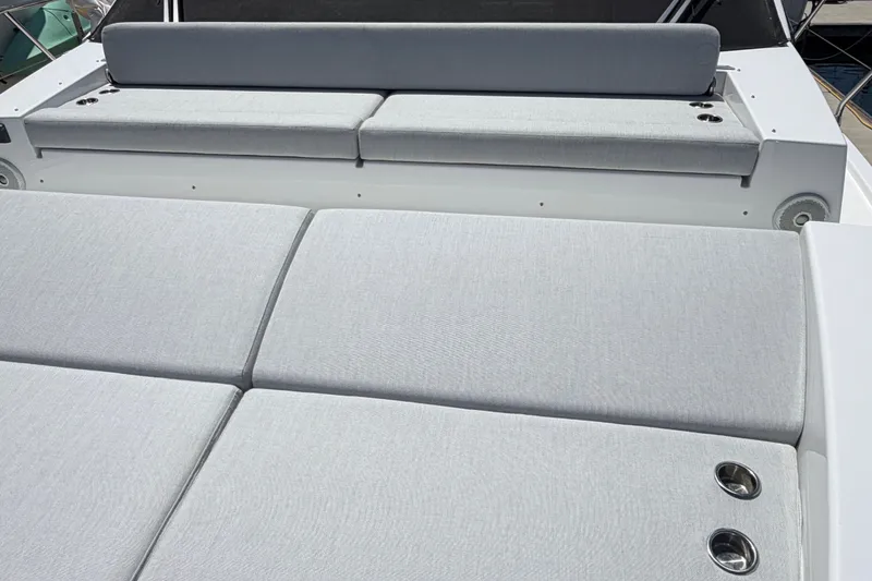Slide: The Image of Luxury seating on 2020 Azimut Fly 50 yacht, featuring sleek gray cushions. - 12