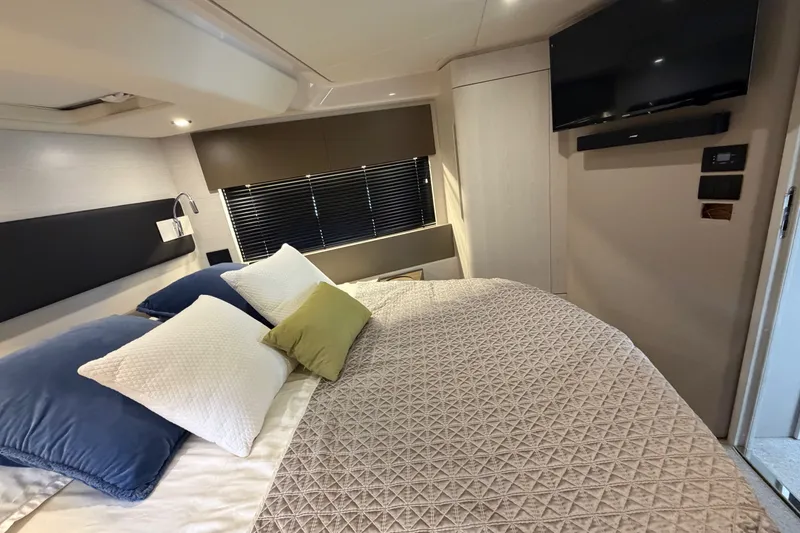 Slide: The Image of Luxurious bedroom interior of 2020 Azimut Fly 50 yacht with modern decor and TV. - 27