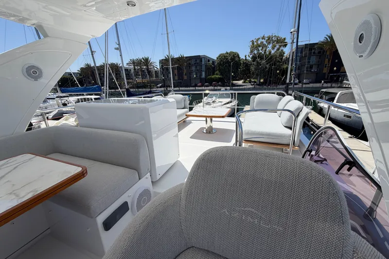 Slide: The Image of Luxurious 2020 Azimut Fly 50 yacht interior with elegant seating and marina view. - 5