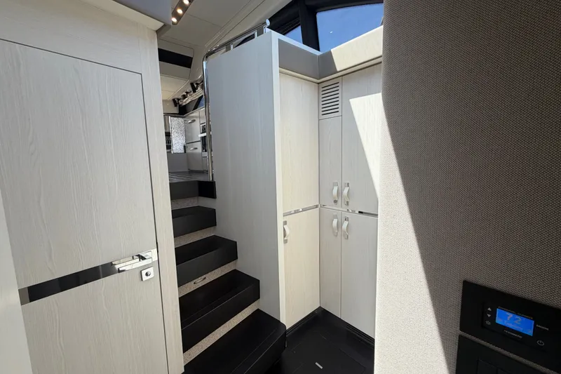 Slide: The Image of Interior of 2020 Azimut Fly 50 yacht, featuring sleek cabinetry and modern design elements. - 24