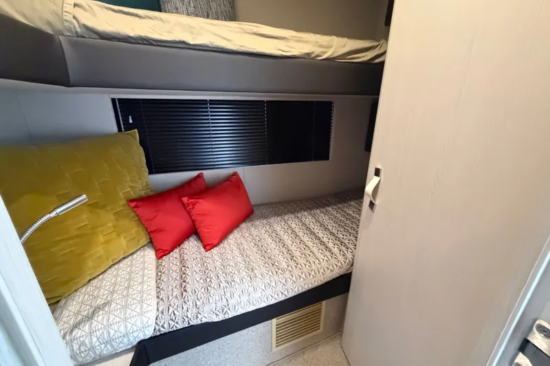 Slide: The Image of Interior cabin of 2020 Azimut Fly 50 yacht with bunk beds and colorful pillows. - 29