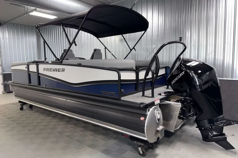Slide: The Image of 2026 Premier 230 Solaris RF Tritoon with Mercury engine in a showroom. - 33