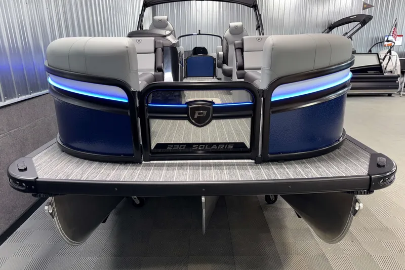 Slide: The Image of 2026 Premier 230 Solaris RF Tritoon with sleek design and blue LED accents. - 36